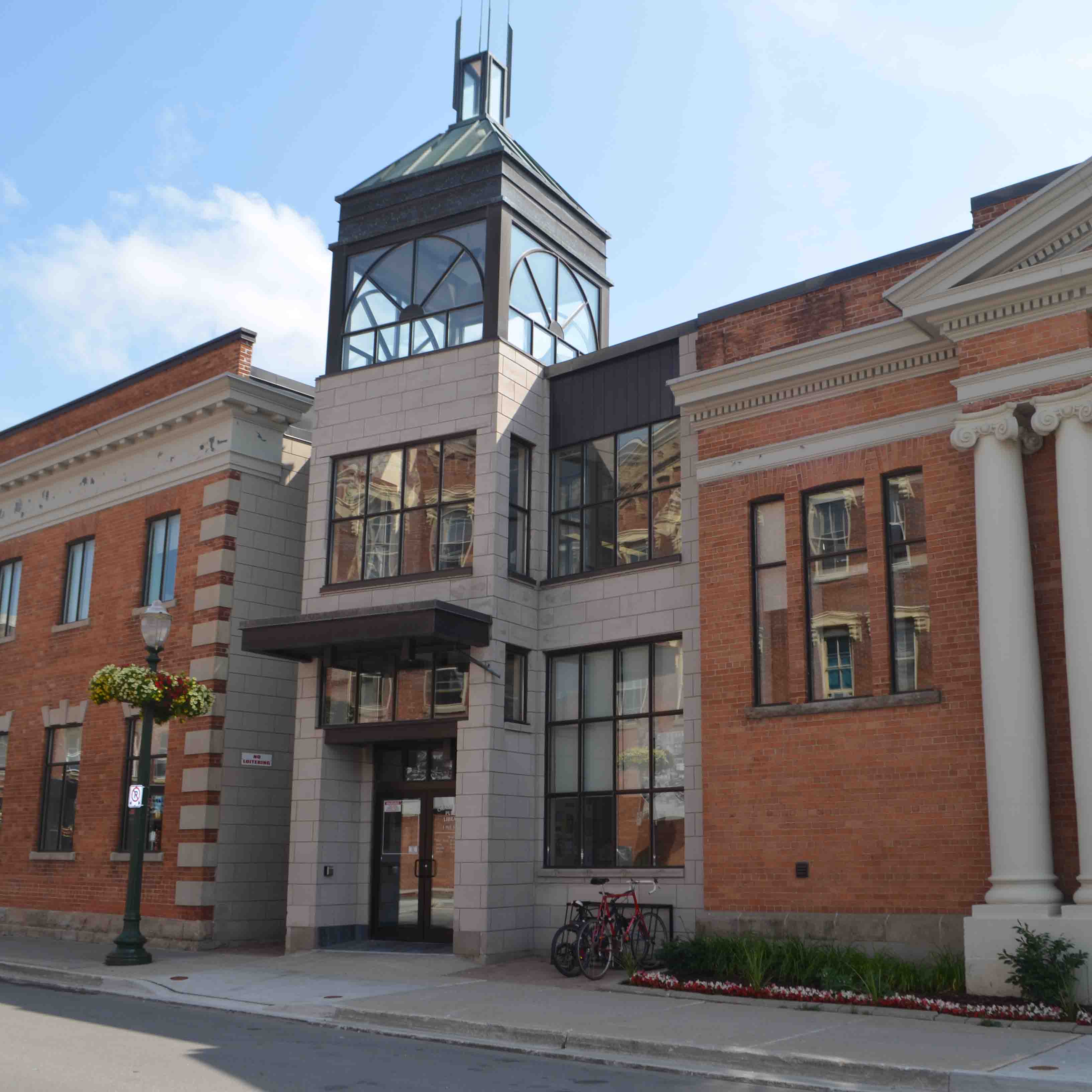 A large, historical building. The Orangeville Public Library Mill Street Branch's entrance off Mill Street in Orangeville.